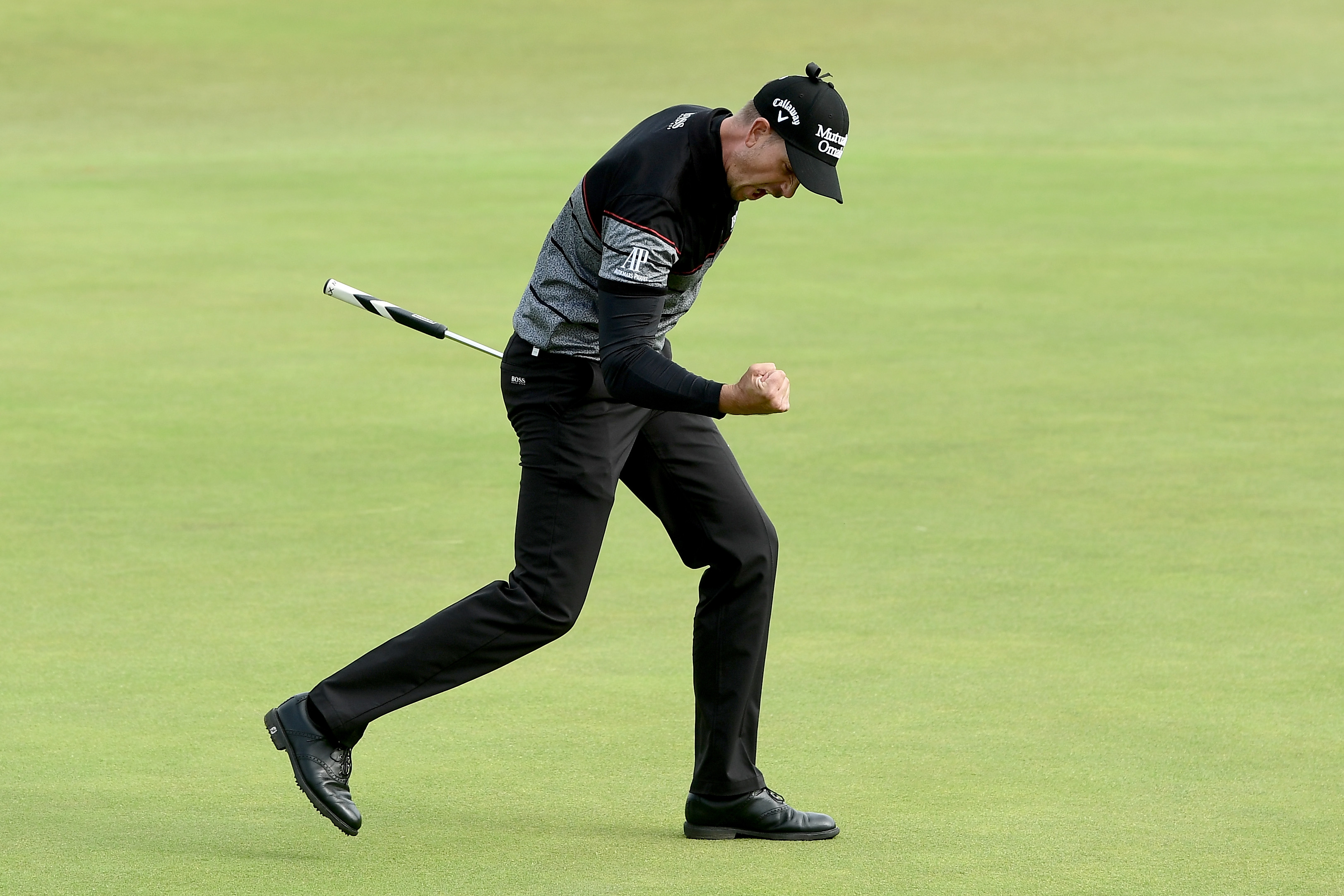 TROON, SCOTLAND - JULY 17: Henrik Stenson of Sweden reacts to a birdie putt on the 15th green during the final round on day four of the 145th Open Championship at Royal Troon on July 17, 2016 in Troon, Scotland. (Photo by David Cannon/R&A/R&A via Getty Images)