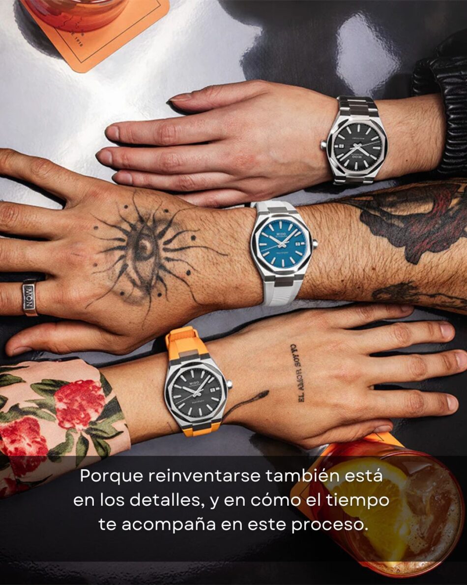MIDO MULTIFORT 8 ONE CROWN 1 Watches World Three wrists wearing metal watches black blue and orangestrap rest on a dark surface visible tattoos and an orange drink in the corner
