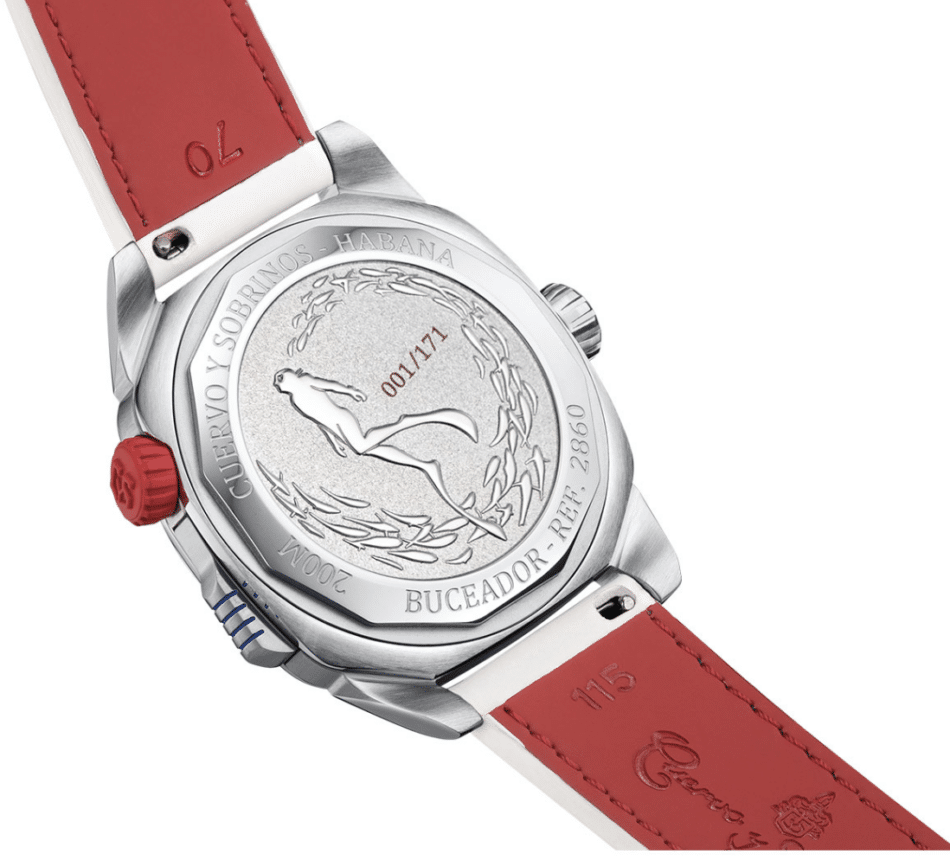 CUERVO Y SOBRINOS BUCEADOR CARIBE CARÁTULA BLANCA Francisco Pipin Ferrerasatrás Watches World Back view of a silver wristwatch with a red leather strap showing an etched emblem on the case back