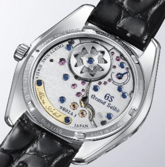 GRAND SEIKO Cascada Mística SBGZ011ATRÁS Watches World Back of a Grand Seiko watch showing the skeleton movement with blue and pink jewels and a black leather strap