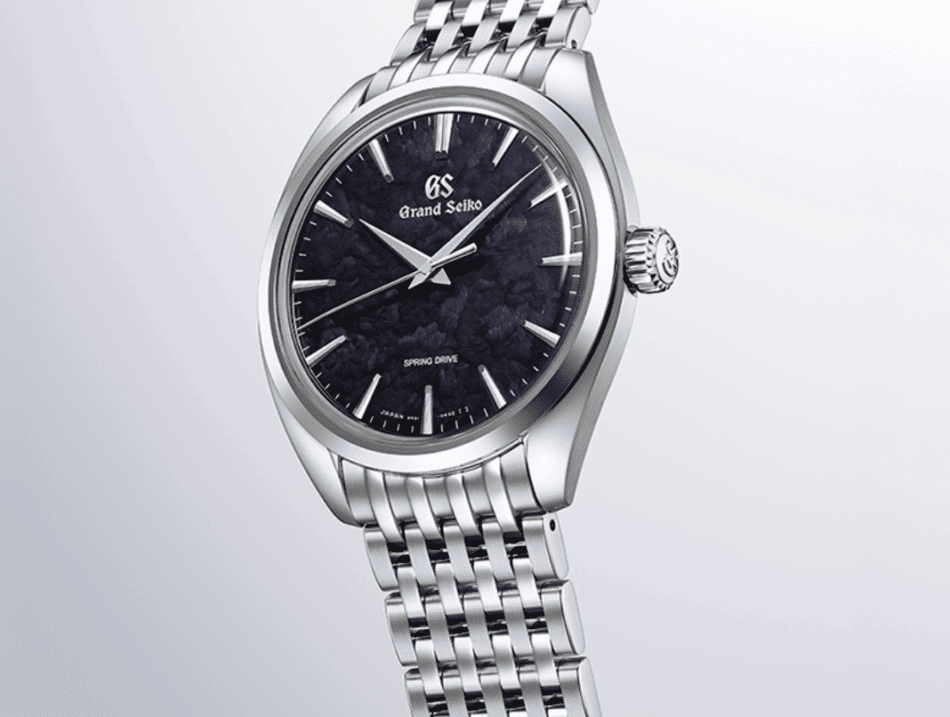 GRAND SEIKOIwao Azul SBGY043COMPLETO Watches World Close up of a Grand Seiko stainless steel wristwatch with a dark textured blue dial and polished bezel