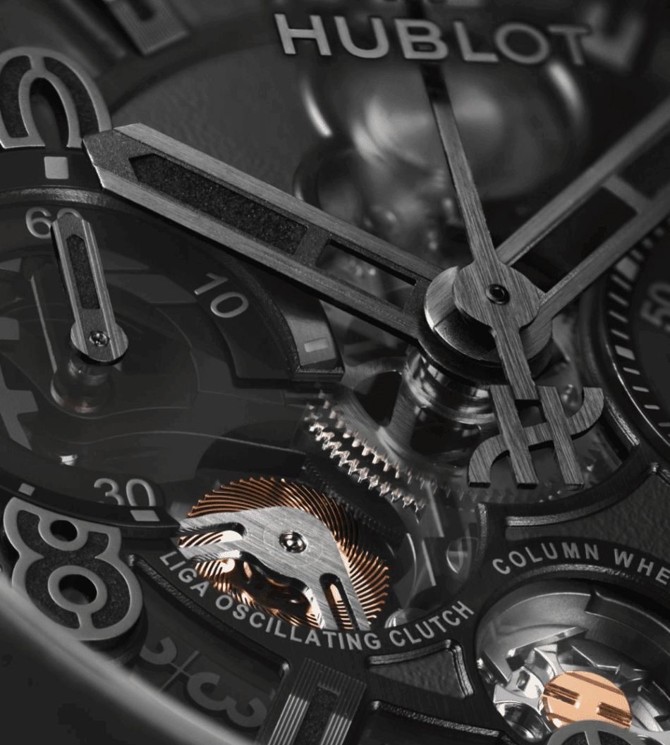 HUBLOT Reloaded All BlackDETALLE Watches World Close up of a high end mechanical watch movement with exposed gears and balance wheel the brand name Hublot and the label LIGA OSCILLATING CLUTCH are visible