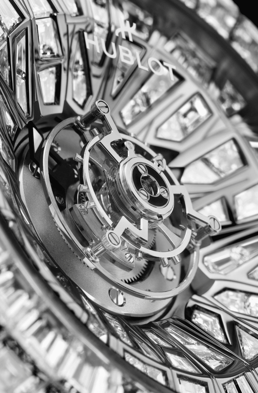 HUBLOTBig Bang Impact One MillionDETALLE Watches World Close up of a Hublot luxury watch movement with gears and a diamond bezel