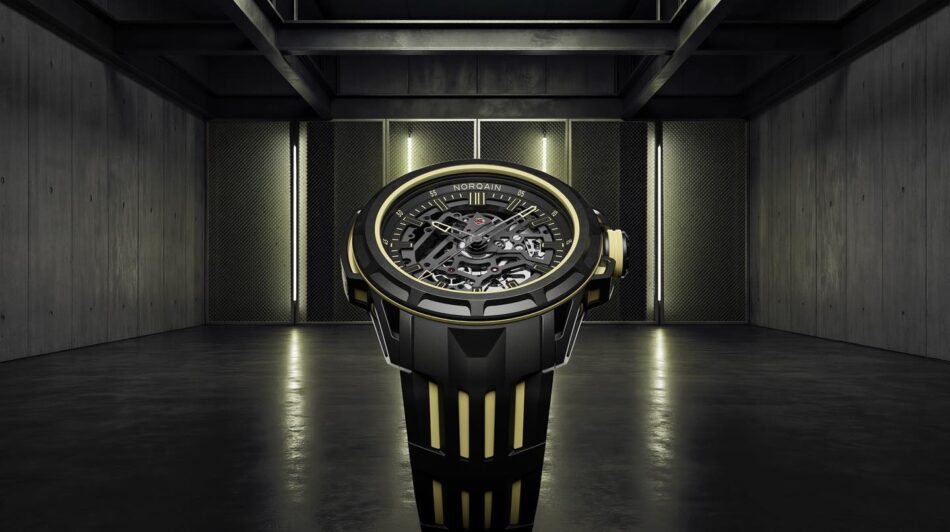 Norqain Wild ONE Skeleton XLite 4 Watches World Norqain Wild ONE Skeleton X Lite 3 NORTEQ el más ligero Luxurious black and gold skeleton wristwatch with visible gears in a moody industrial setting