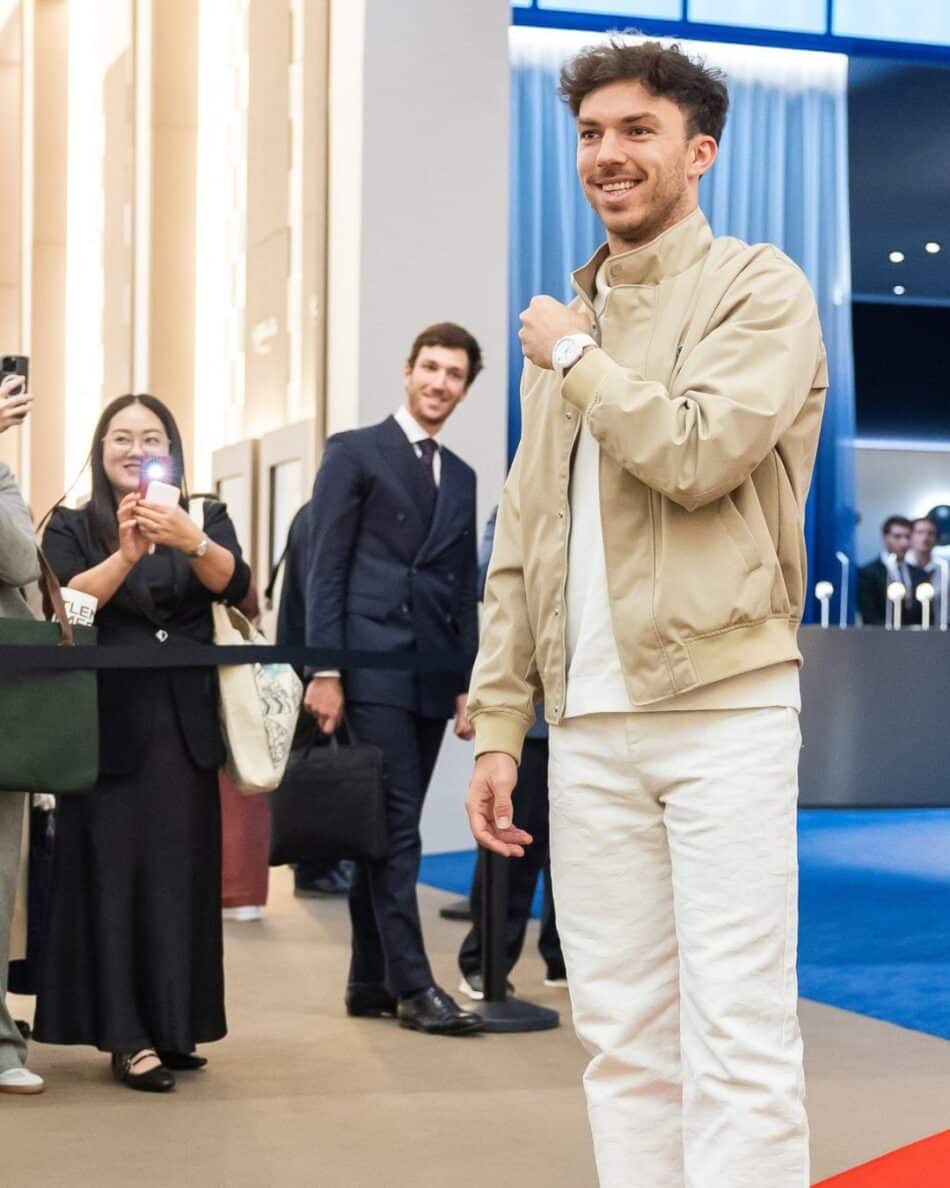 Watches and Wonders Geneva 2026 11 Watches World Watches and Wonders Geneva 2026Man in beige jacket and white pants shows off a watch as photographers crowd around him at an event