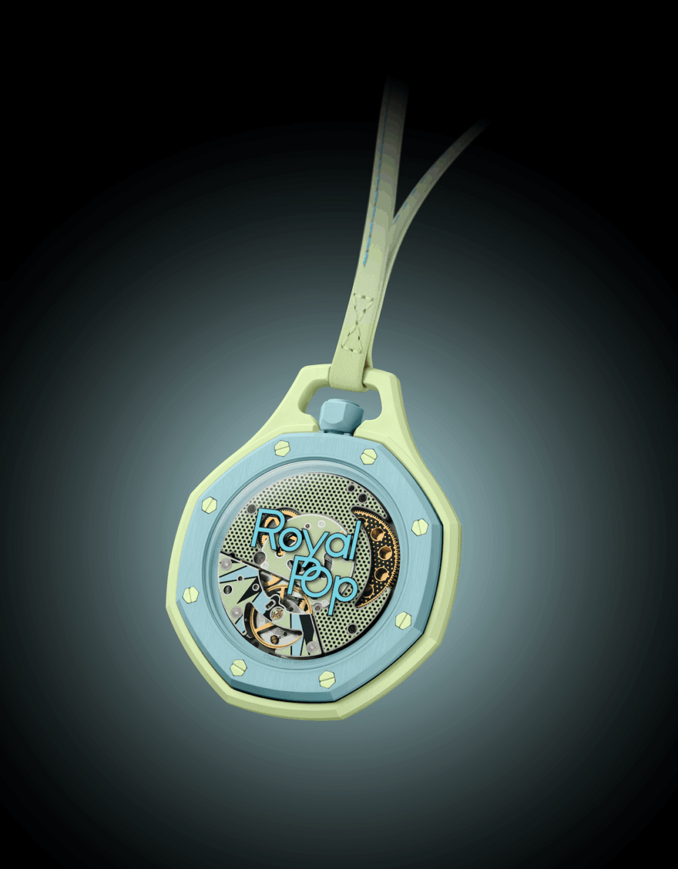 Audemars Piguet × SwatchBLAUE ACHT ATRÁS Watches World Pastel mint and blue mechanical watch pendant with exposed gears hanging from a strap reading Royal Pop