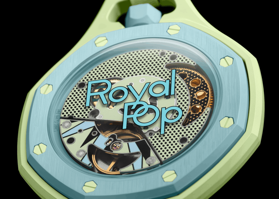 Audemars Piguet × SwatchBLAUE ACHT CLOSE UP Watches World Close up of a colorful mechanical watch interior with lime green case and light blue accents featuring visible gears and the text Royal Pop across