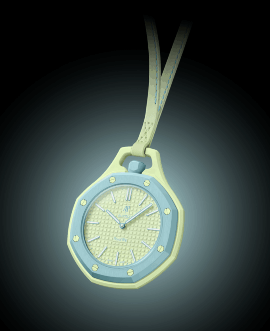 Audemars Piguet × SwatchBLAUE ACHT FRENTE Watches World Pastel yellow and blue pendant watch hanging from a stitched strap against a dark background showing a textured dial and hexagonal screws