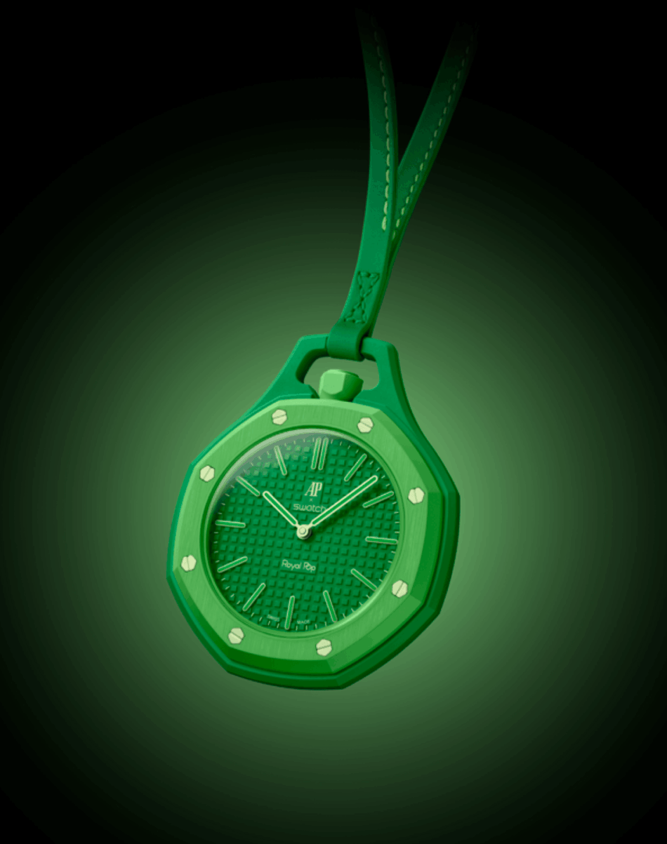 Audemars Piguet × SwatchGREEN EIGHT FRENTE Watches World Green octagonal pendant watch with a textured dial hanging from a green leather strap against a dark green glow
