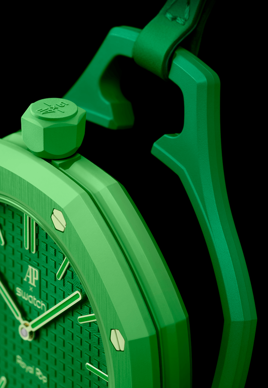 Audemars Piguet × SwatchGREEN EIGJT CORONA Watches World Close up of a bright green geometric wristwatch with a textured dial and bold hands against a black background