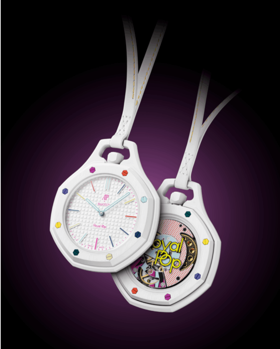 Audemars Piguet × SwatchHAUT BLANC DUO Watches World Two white pendant watches with rainbow gems hang against a dark purple spotlight one showing a pastel dial and the other an open colorful gear design reading Royal Pop