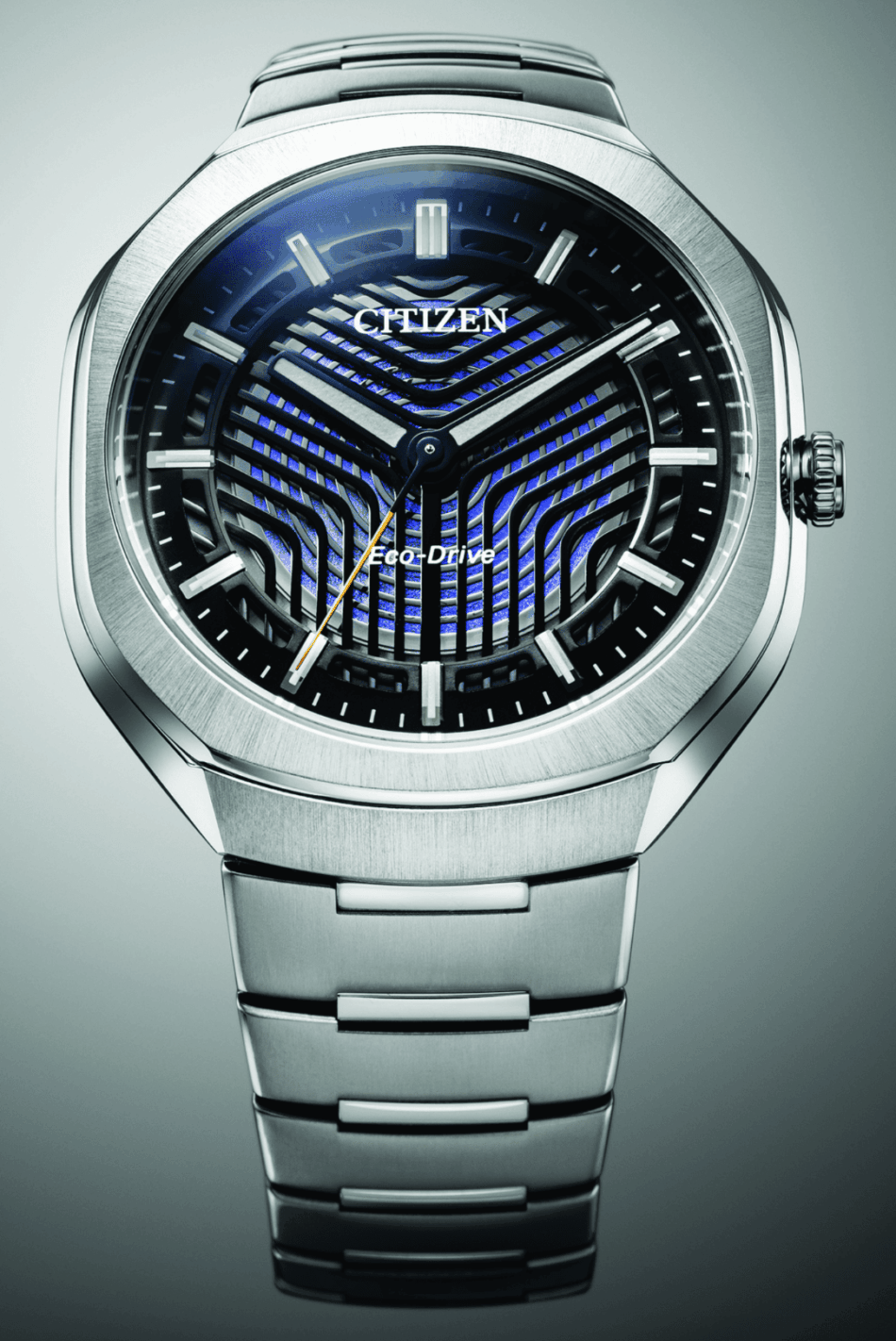 Citizen EcoDrive Photon celebra 50 aniversario 5 Watches World Citizen Eco Drive Photon Two tone Citizen Eco Drive wristwatch with a gold bezel intricate lattice dial and metal braceletCitizen Eco Drive Photon Two tone Citizen Eco Drive wristwatch with a gold bezel intricate lattice dial and metal bracelet Close up of a silver Citizen Eco Drive wristwatch with a blue patterned dial and metal bracelet