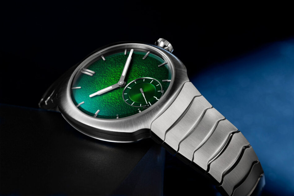 H Moser Streamliner Small Seconds Lime GreenCOMPLETO LIFESTYLE Watches World Close up of a stainless steel wristwatch with a textured green dial and a small subdial angled against a dark background
