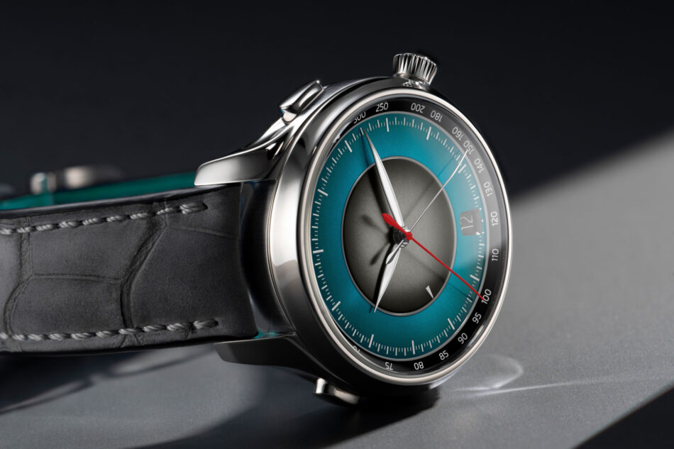 HMoser17301200EndeavourFlybackChronographDualTimeDateSTLifestylesideclose Watches World Close up of a silver wristwatch with a blue dial and black leather strap