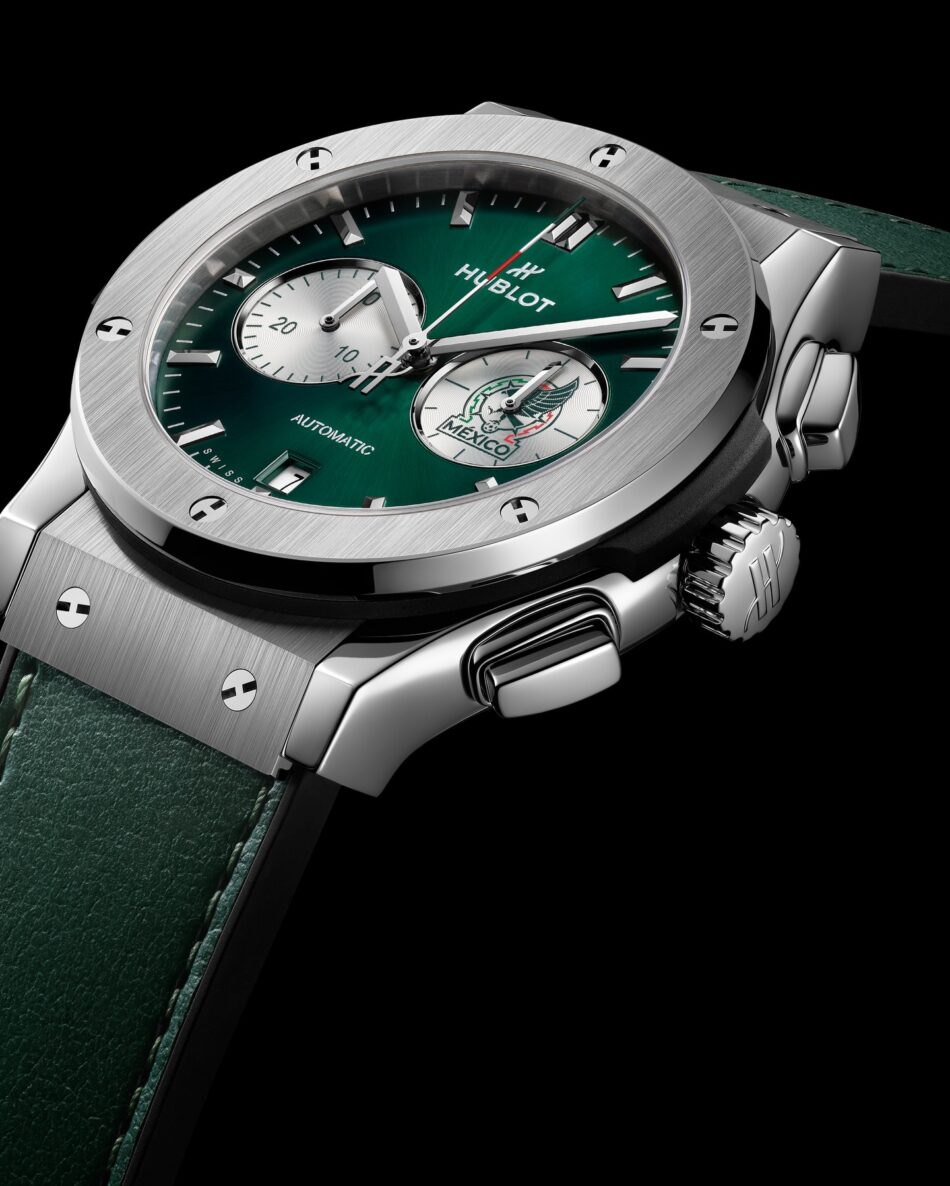 Hublot Classic Fusion Chronograph SNM Titanium 3 Watches World Hublot Classic Fusion Chronograph SNM Titanium 3 Close up of a luxury wristwatch with a green sunburst dial silver subdials and a brushed metal bezel Hublot and green strap
