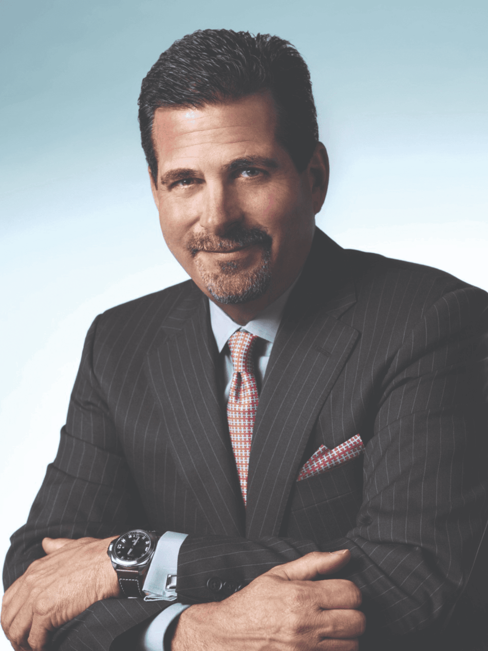 Jeffrey Cohen presidente de Citizen Watch America 2 Watches World Jeffrey Cohen presidente de Citizen Watch America Businessman in a pinstripe suit with an orange tie and pocket square arms crossed facing the camera