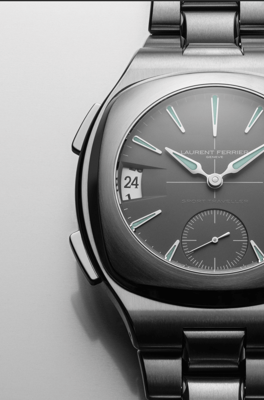 Laurent Ferrier Sport TravellerCLOSE UP VERTICAL Watches World Close up of a stainless steel Laurent Ferrier Sport Traveller watch dial with teal accented hour markers and date window near 9 o'clock.