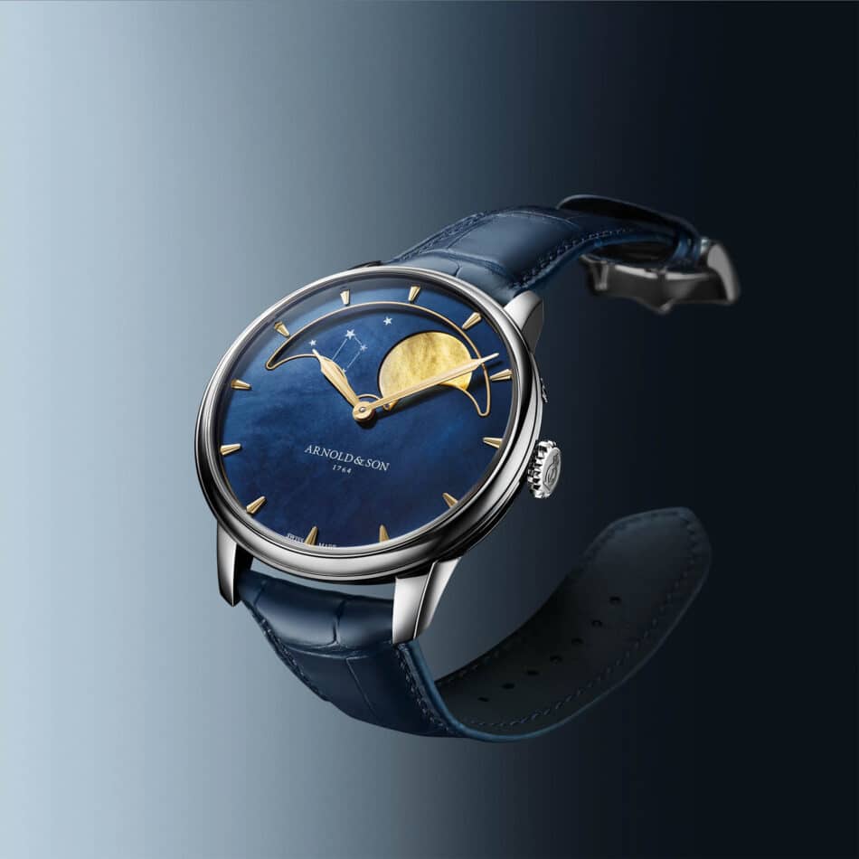 Stacked from 16 images Method=B R=8S=4 Watches World Close up of a blue dial luxury wristwatch with gold hands and a blue leather strap