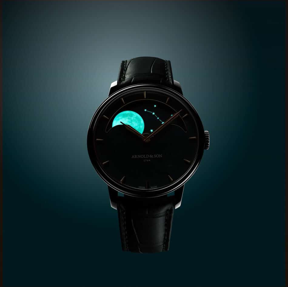 Stacked from 23 images Method=B R=8S=4 Watches World Close up of a black leather strap wristwatch with a dark dial showing a turquoise moon and star constellation design and small brand text