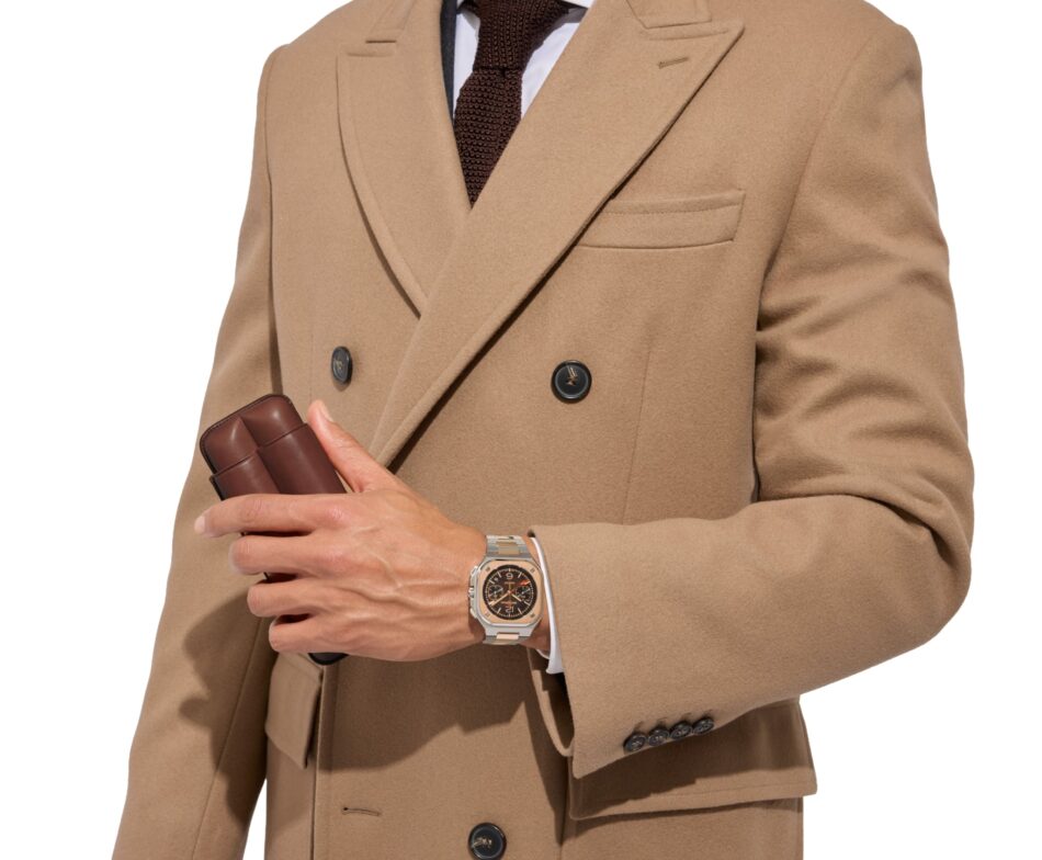 Bell Ross BR05 Chrono ST Dupont 3 Watches World Bell Ross BR 05 Chrono ST Dupont Person in a tan double breasted coat holding a brown leather case wearing a brown tie and a silver wristwatch