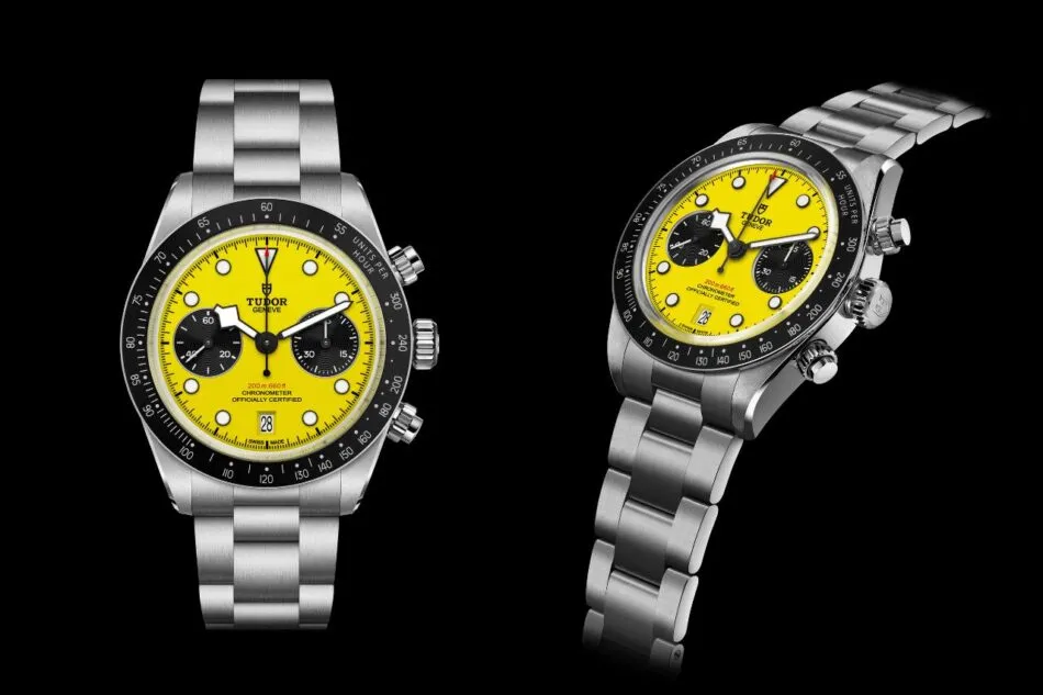 Dos relojes cronógrafos Tudor con esferas de color amarillo brillante y brazaletes de acero inoxidable sobre un fondo negro.