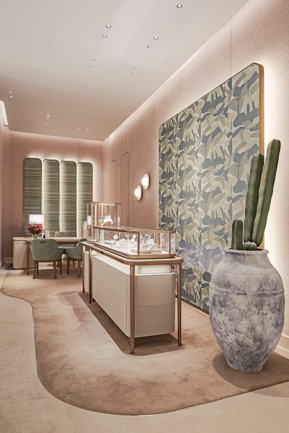 Boutique Cartier dentro de El Palacio de Hierro Monterrey 2 Watches World Boutique Cartier dentro de El Palacio de Hierro Monterrey Elegant jewelry showroom with a glass display case soft pink walls and green upholstered seating