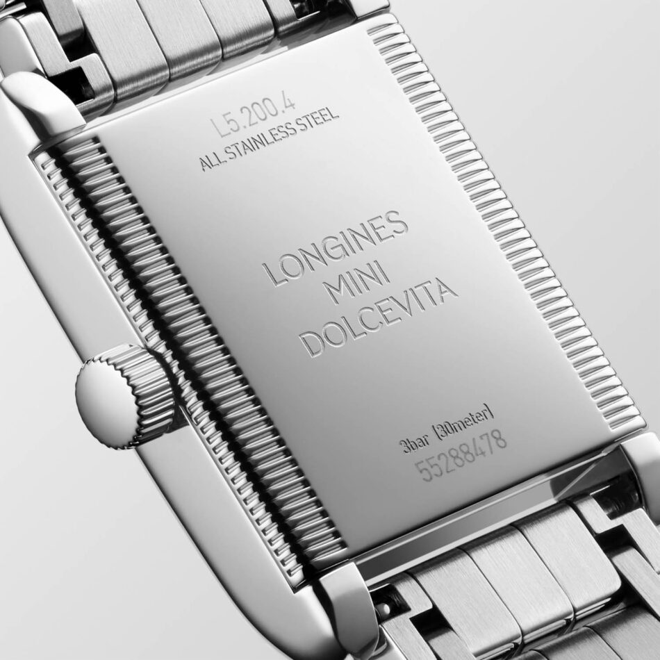 Longines presenta los Mini DolceVita más brillantes y sofisticados hasta la fecha Watches World Close up of a stainless steel Longines Mini Dolcevita watch case back with engraved model name and serial digits visible to the right