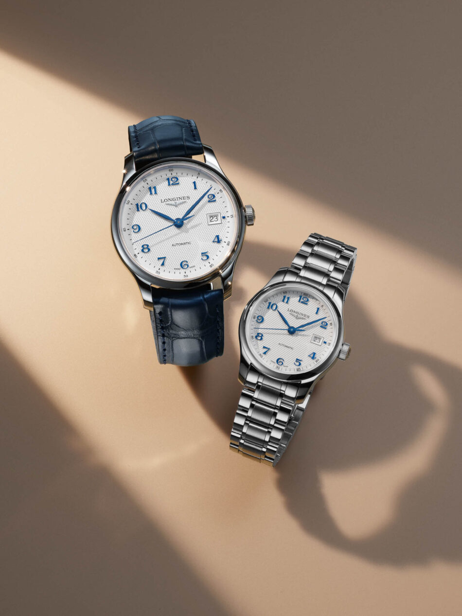 Longines reinventa la Master Collection con nuevos tamaños y carátulas texturizadas Watches World Two elegant Longines watches on a beige backdrop one with a blue leather strap and the other with a silver metal bracelet