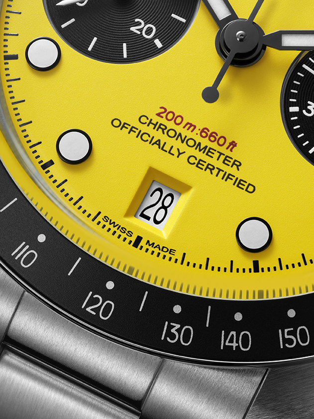 Black Bay Chrono 39 Bumblebee TUDOR apuesta por el amarillo más atrevido Watches World Close up of a bright yellow chronometer watch face with date window showing 28 and black subdials nearby 200m water resistance text visible
