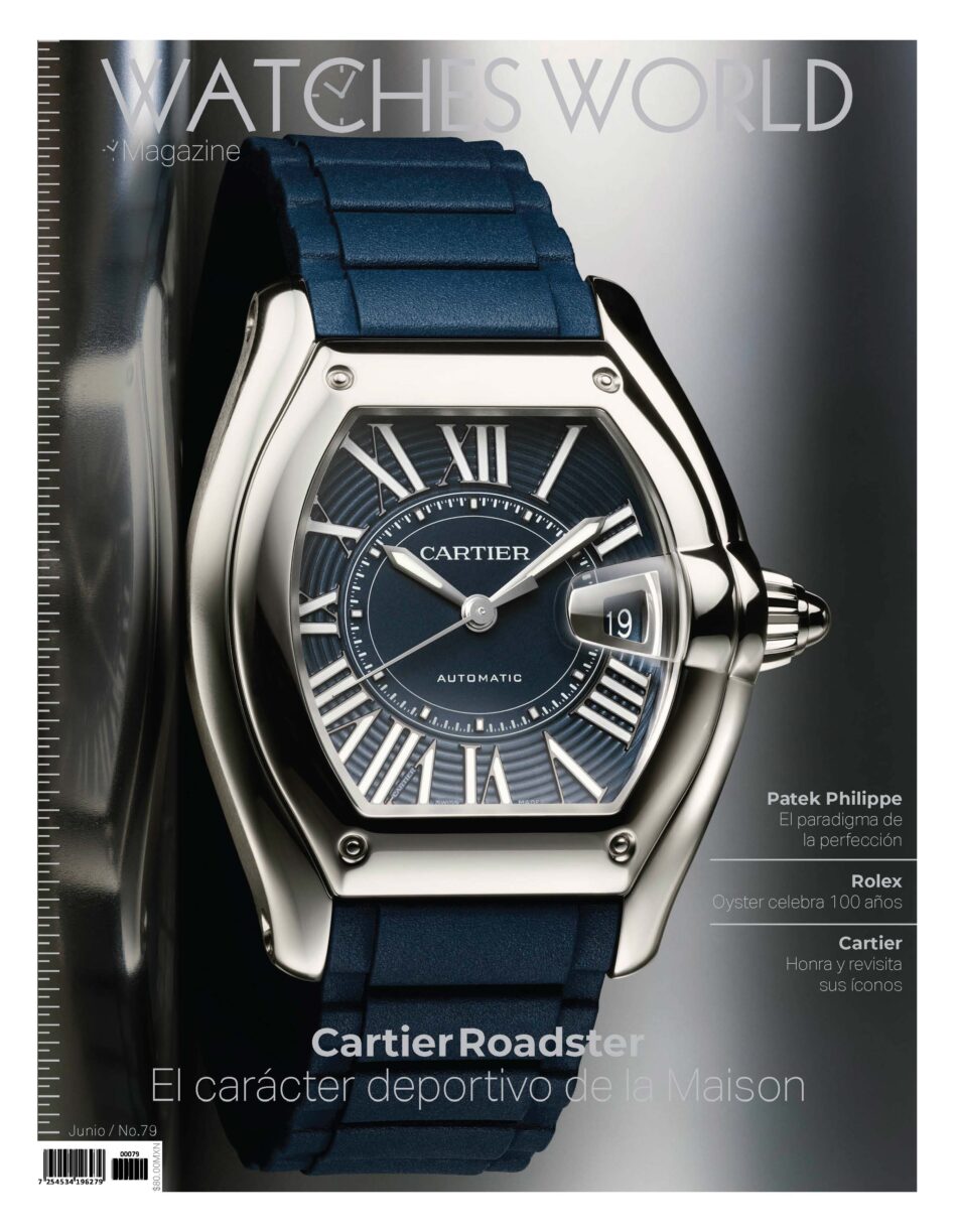 WW79 Junio Portada High Res Watches World Close up of a blue Cartier Roadster watch on a glossy magazine cover showing Roman numerals and the word Automatic on the dial