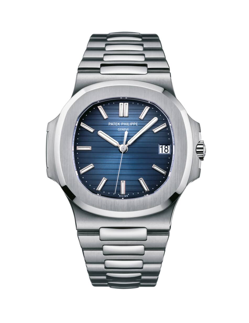 57111A001 Watches World Close up of a stainless steel luxury watch with a blue striped dial date window at 3 o'clock, and silver hands (Patek Philippe).