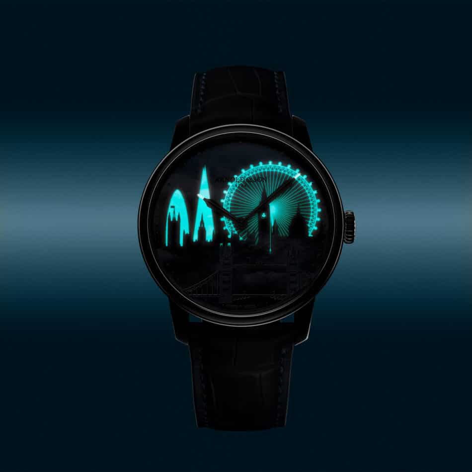 HM London Skyline con efecto SuperLumiNova revelando el horizonte moderno de Londres Watches World Primer plano de un reloj de pulsera negro con un diseño de la silueta urbana en color verde azulado y una noria que se ilumina por la noche en el interior de la esfera