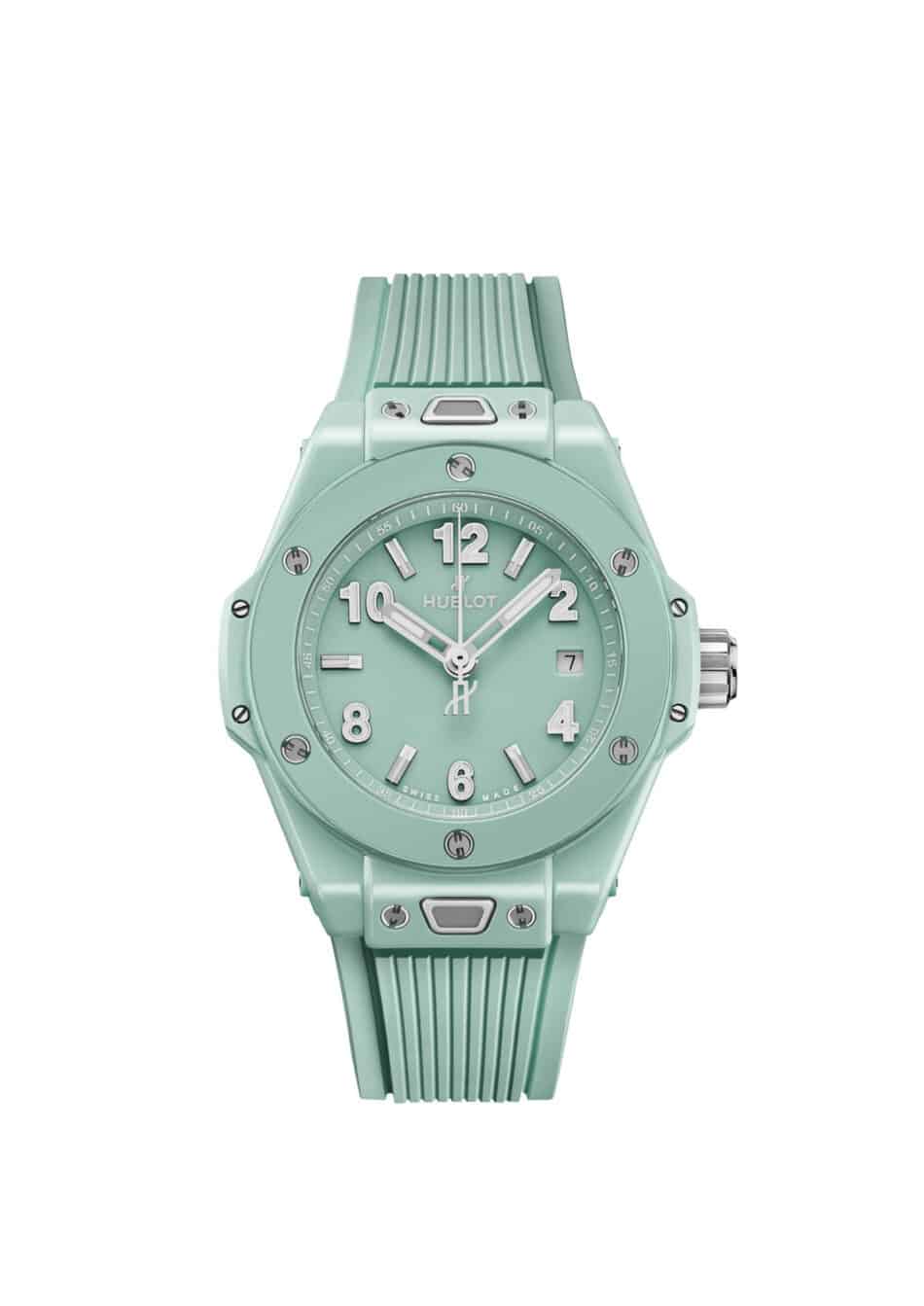 HublotBig Bang Mint Green Ceramic 4 Watches World Mint green Hublot wristwatch with a ribbed strap large numerals and a date window