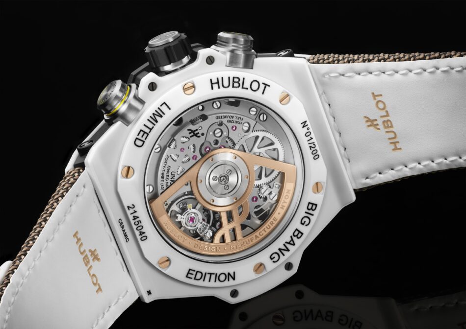 HublotBig Bang Reloaded Kylian Mbappé 4 Watches World Close up of a white Hublot watch showing its transparent caseback with visible gears and a gold rotor
