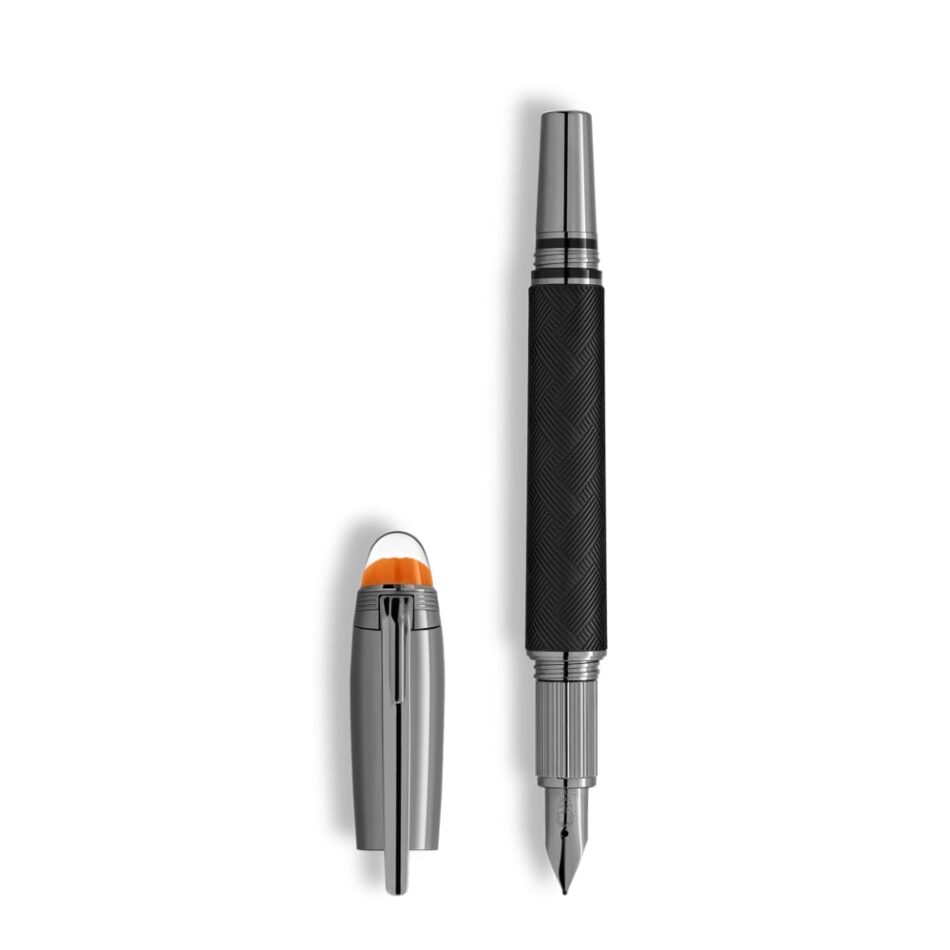 Montblanc StarWalker Extreme 5 Watches World Montblanc StarWalker Extreme Three black pens with orange tipped caps standing upright on a light beige background Fountain pen with black grip and silver nib cap removed and placed to the left on white background