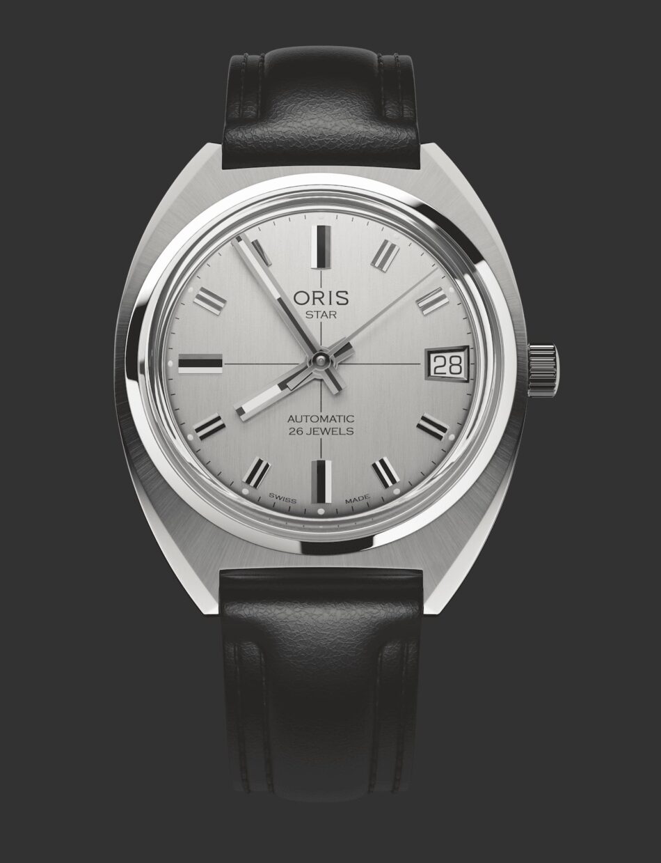 Oris Star y Dr Portmann Watches World Oris Star y Dr Portmann Close up of a silver wristwatch with a black leather strap showing date window and'ORIS' branding on a gray dial (automatic, 26 jewels).