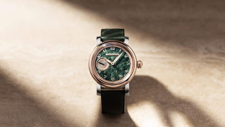 Chronoswiss Small Second Serpentine Soldat Watches World Rose gold framed wristwatch with a green textured dial and black leather strap resting on a sunlit surface