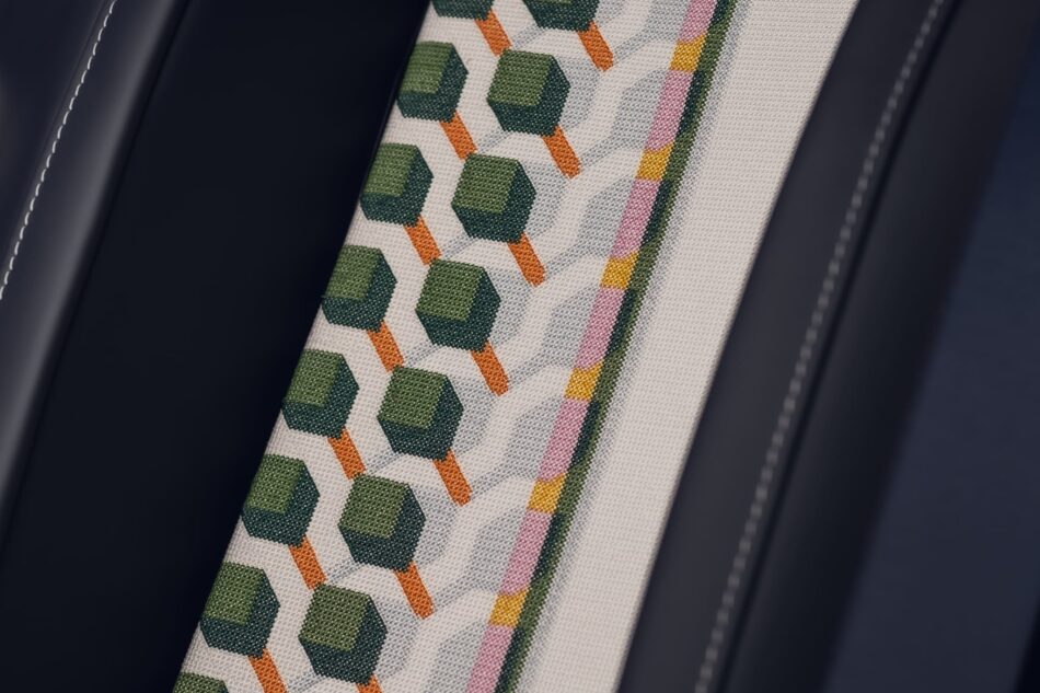 RollsRoyce Ghost Savile Row 11 Watches World Rolls Royce Ghost Savile Row Close up of a geometric fabric pattern with green hexagons and orange diagonal lines framed by dark leather edges